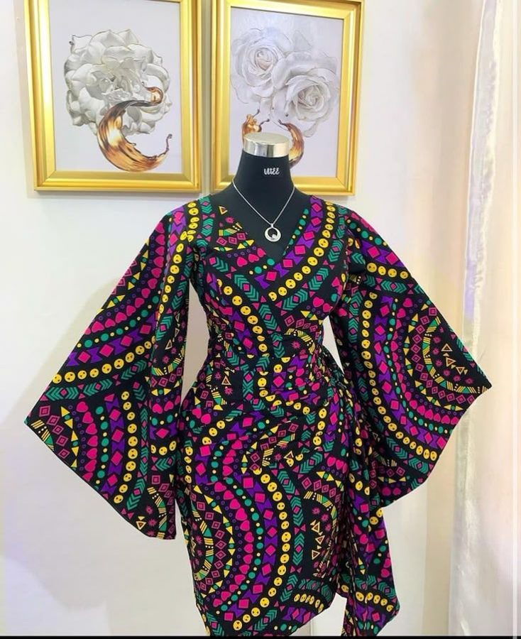 Rainbow Ankara kimono on a rail